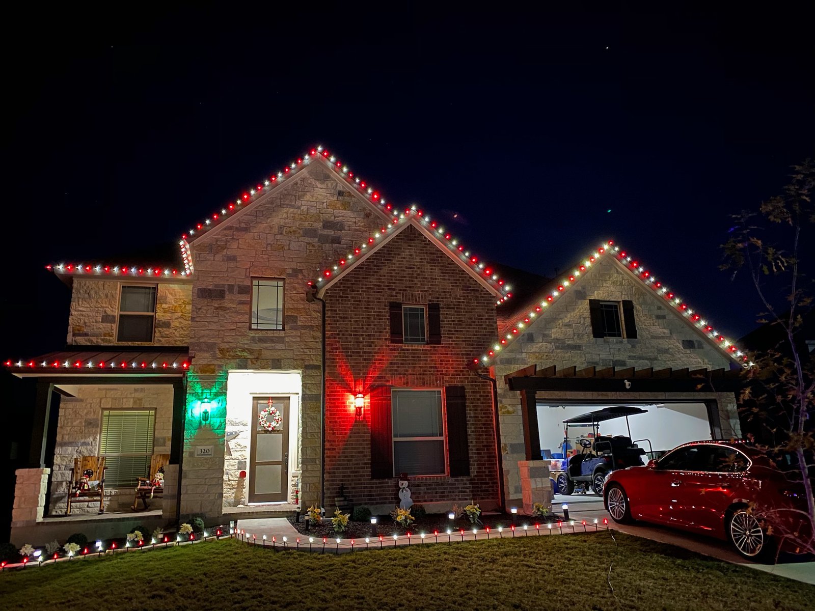 Red and white Christmas roofline lighting installation
